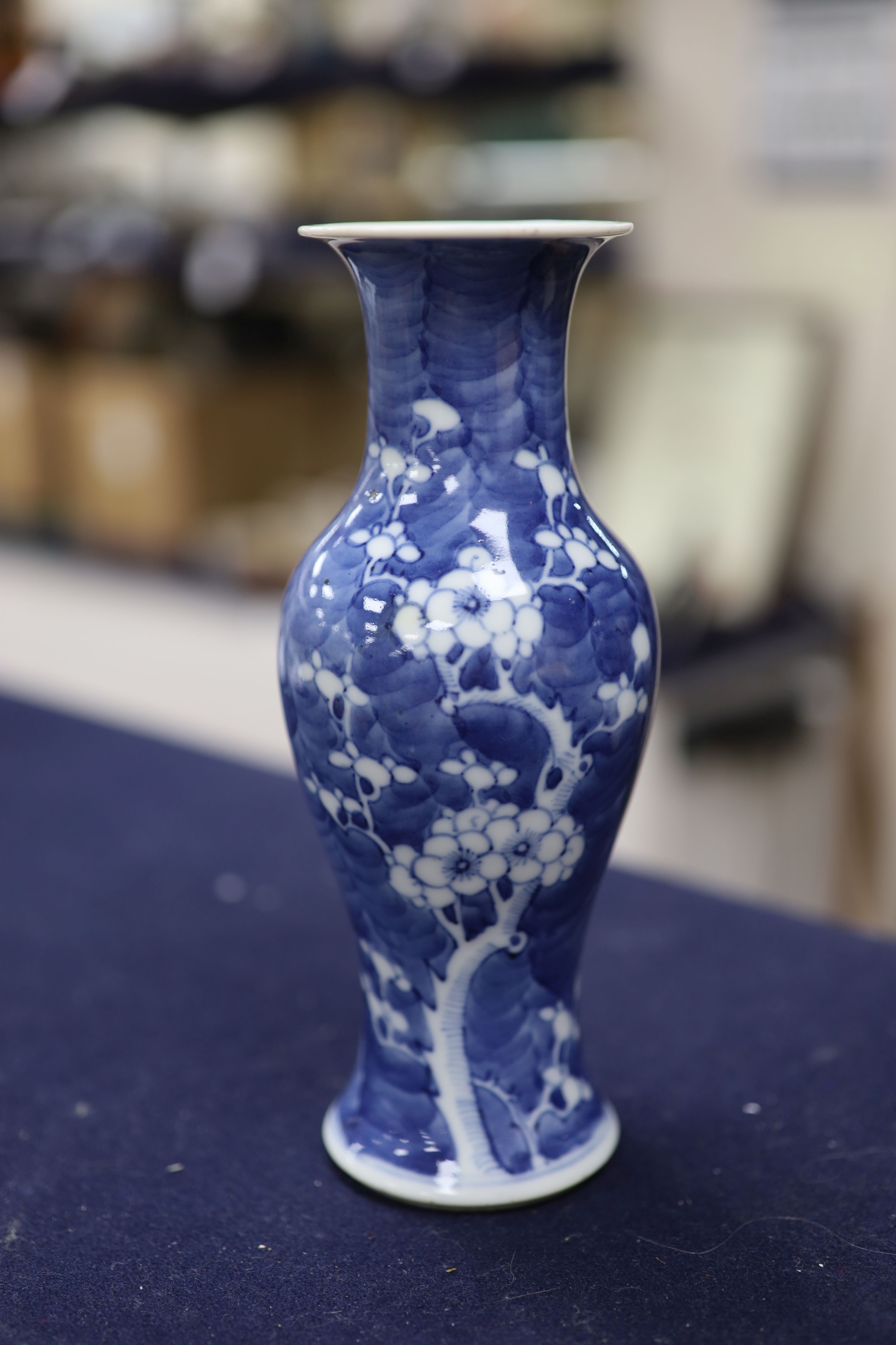 Two Chinese blue and white vases and a dish, together with a famille rose dish, tallest 28cm